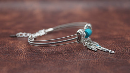 Turquoise and Silver Bracelet with Feather Charm